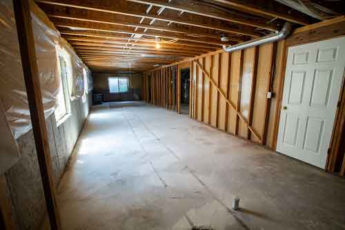 Image of a basement needing electrical and walls
